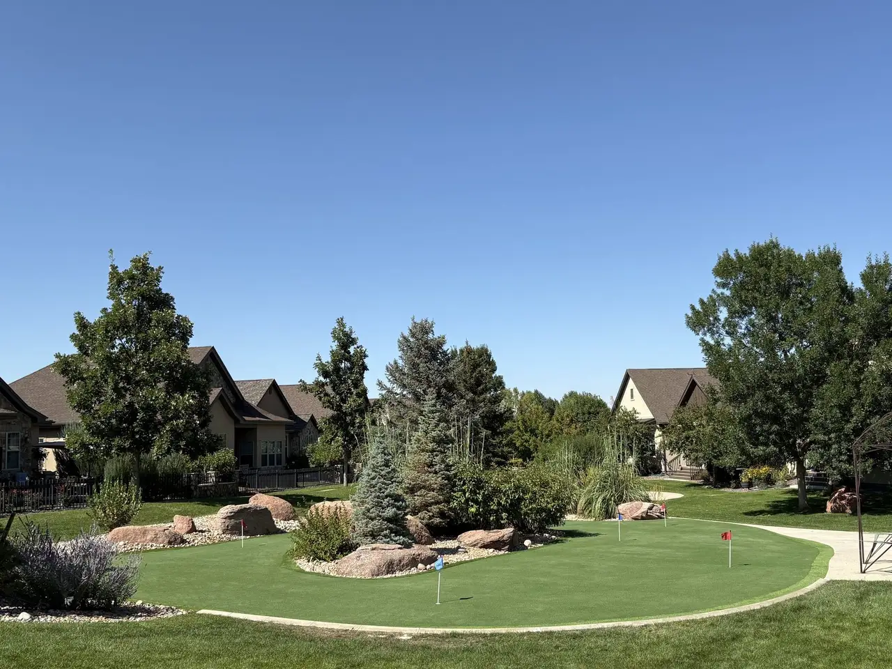 The same putting green seen from the street, showing how it sits in the whole yard